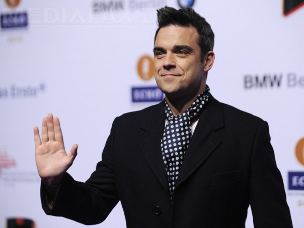 Imaginea articolului Robbie Williams spune că îmbătrâneşte şi se transformă încet în tatăl său