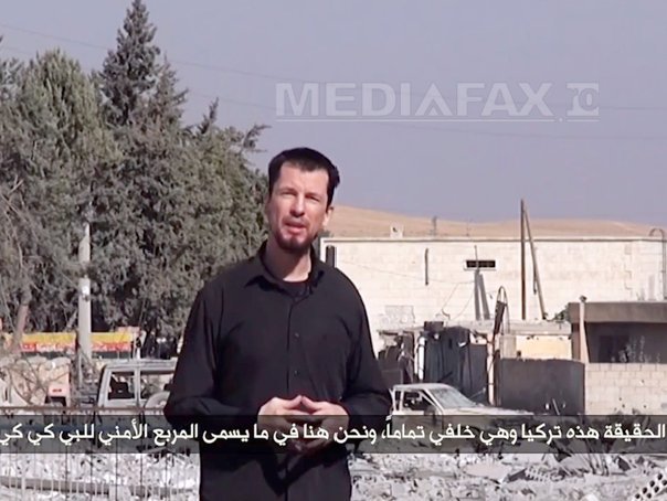 Imaginea articolului Gruparea SI difuzează o nouă înregistrare video cu ostaticul britanic John Cantlie